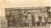 large group in front of bus